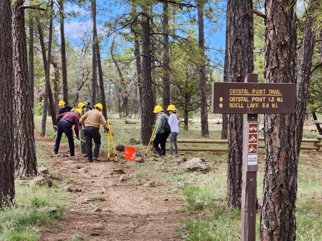 The work begins on Crystal Point Trail, May 13, 2023